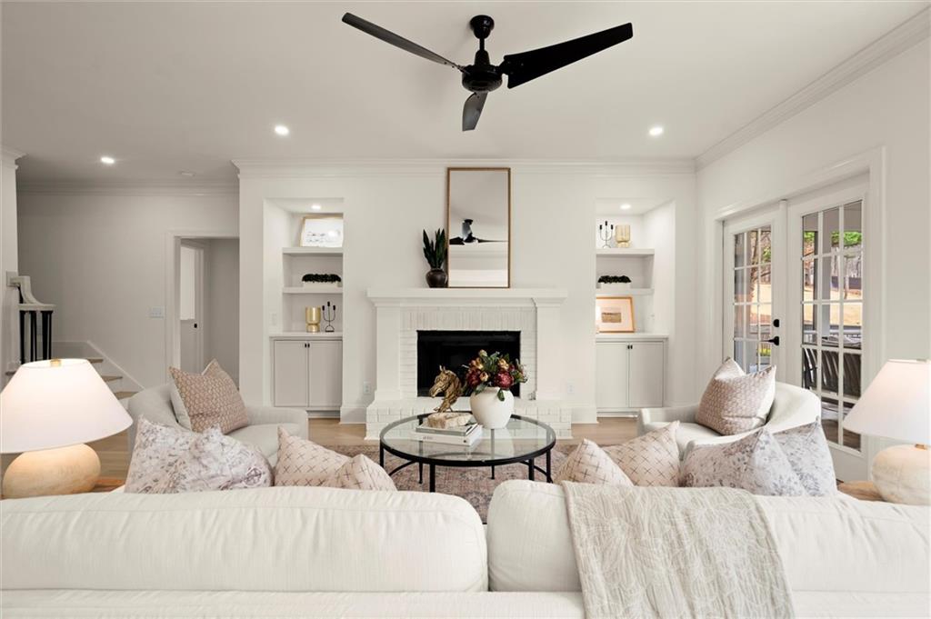 539 Schofield Drive Powder Springs, GA 30127 - Photo 13 of 45 a living room with furniture and a fireplace