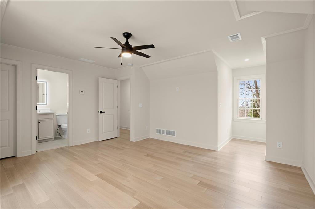 539 Schofield Drive Powder Springs, GA 30127 - Photo 24 of 45 a view of empty room with wooden floor