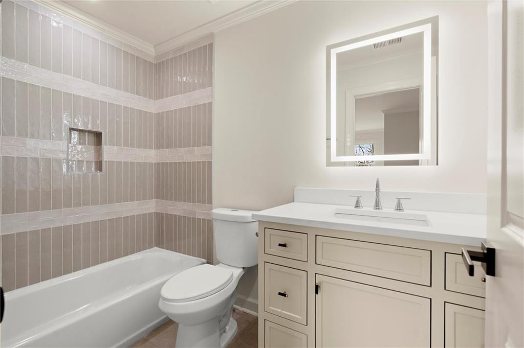 539 Schofield Drive Powder Springs, GA 30127 - Photo 27 of 45 a bathroom with a sink toilet vanity and tub