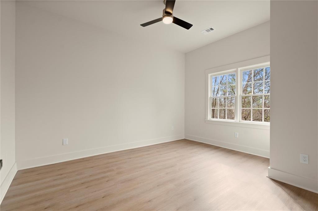 539 Schofield Drive Powder Springs, GA 30127 - Photo 34 of 45 wooden floor in an empty room with a window