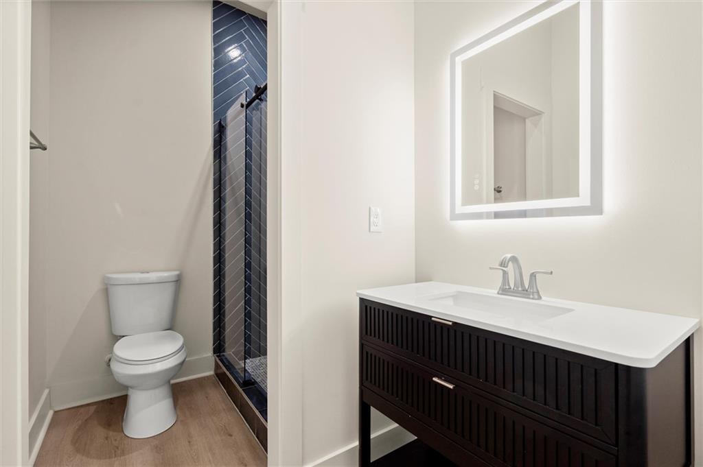 539 Schofield Drive Powder Springs, GA 30127 - Photo 35 of 45 a bathroom with a toilet sink and mirror