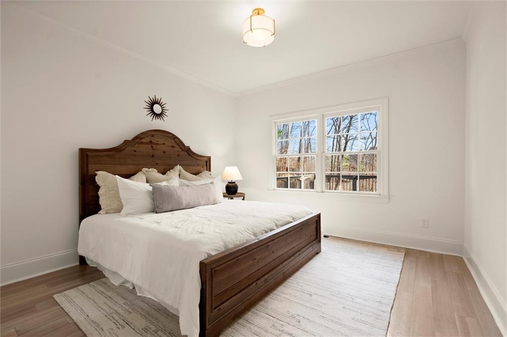 539 Schofield Drive Powder Springs, GA 30127 - Photo 38 of 45 a large bed sitting in a bedroom next to a window