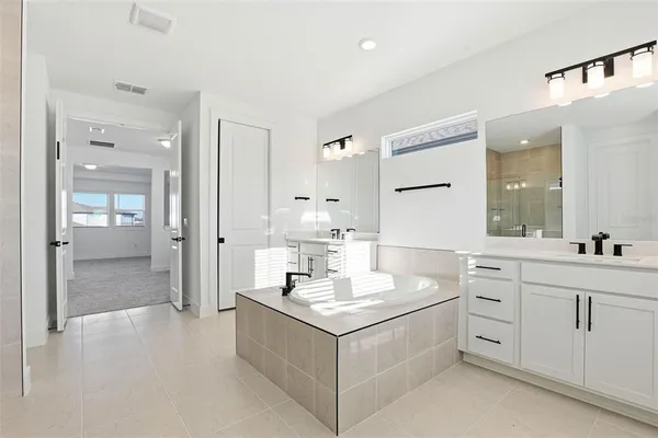 an aerial view of a house with a swimming pool