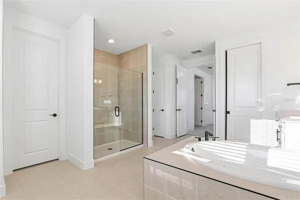 a view of a dining room with furniture wooden floor and chandelier