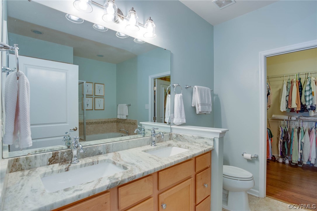 5841 Riverside Trail Richmond, VA 23225 - Photo 15 of 28 a bathroom with a granite countertop double vanity sink and a mirror