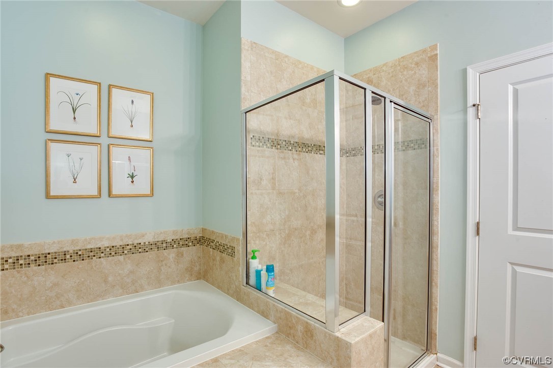 5841 Riverside Trail Richmond, VA 23225 - Photo 16 of 28 a bathroom with a bathtub and a shower