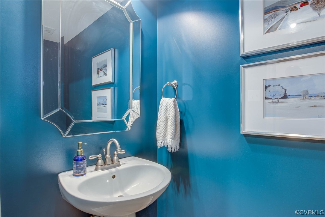 5841 Riverside Trail Richmond, VA 23225 - Photo 17 of 28 a bathroom with a sink and a mirror