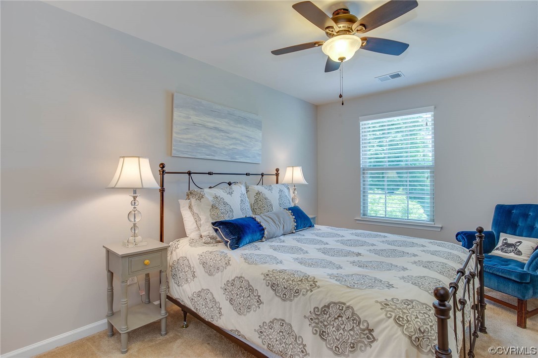 5841 Riverside Trail Richmond, VA 23225 - Photo 23 of 28 a bedroom with a bed and a lamp