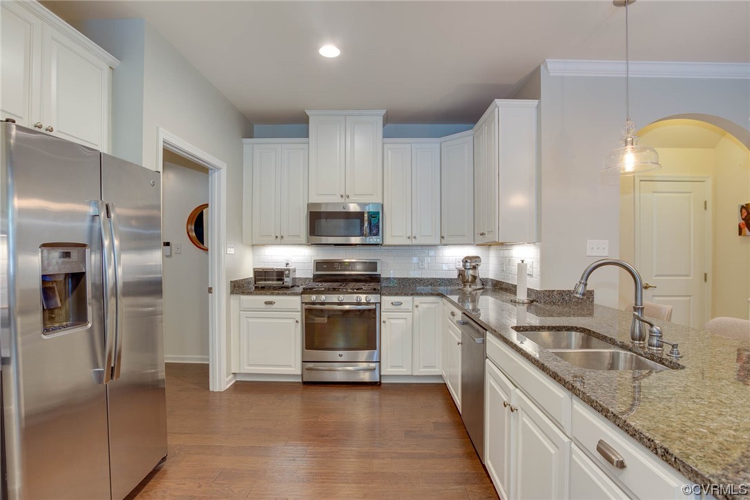 5841 Riverside Trail Richmond, VA 23225 - Photo 5 of 28 a kitchen with stainless steel appliances granite countertop a sink a stove a refrigerator and cabinets