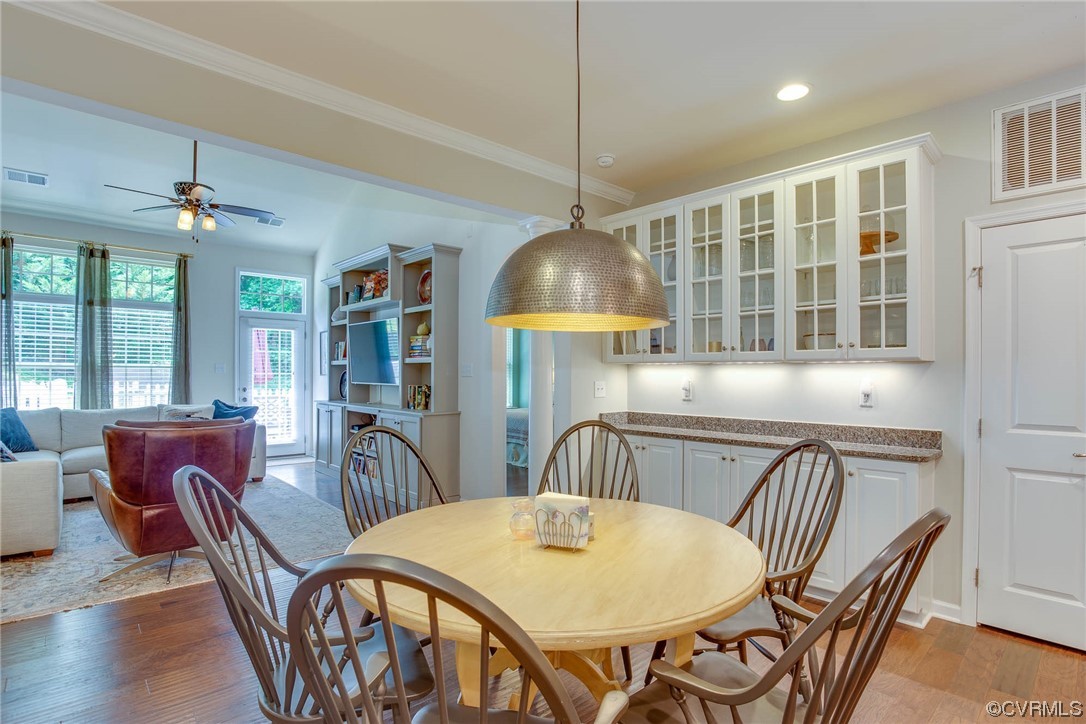5841 Riverside Trail Richmond, VA 23225 - Photo 8 of 28 a view of a dining room with furniture window and wooden floor