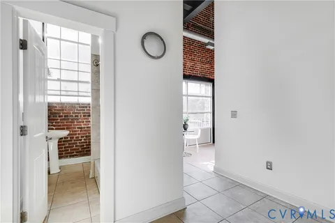 a bedroom with furniture and a rug