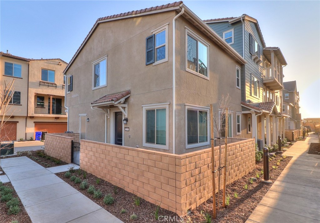 2109 Crescent Moon Upland, CA 91786 - Photo 1 of 1 a front view of a house with many windows