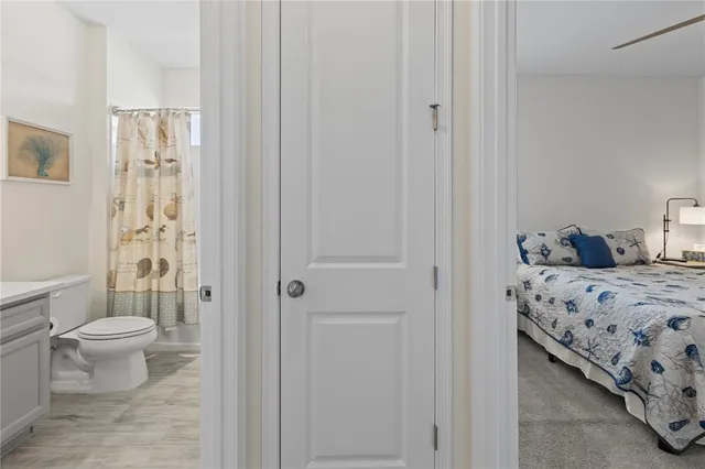 a bedroom with a bed and a shower