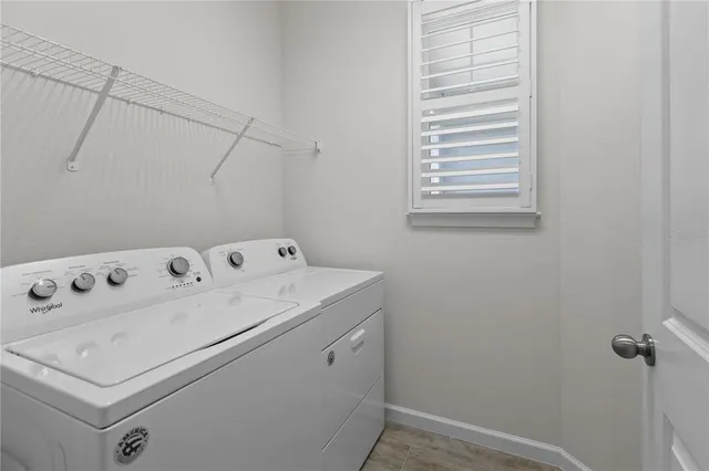 a utility room with dryer and washer