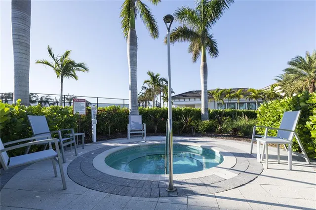 a swimming pool with outdoor seating and yard