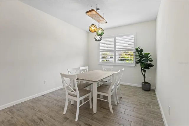 a dining room with furniture and window