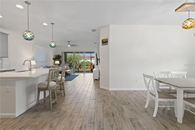 a very nice looking dining room with a table and chairs