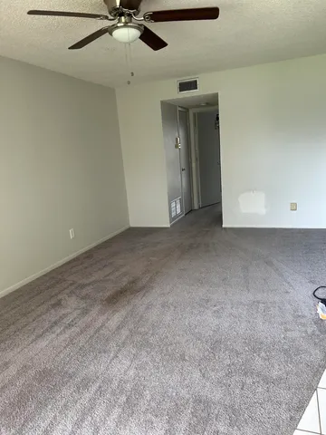 a view of a livingroom with a ceiling fan