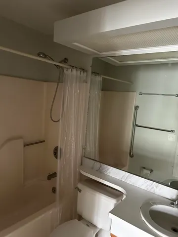a bathroom with a sink and a shower