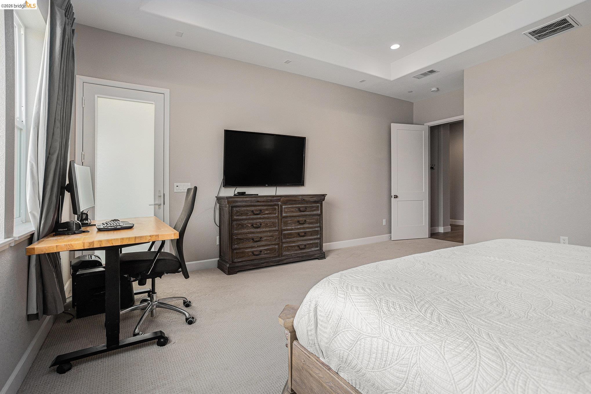 5010 Neroly Road Oakley, CA 94561 - Photo 20 of 40 a bedroom with a bed and a flat screen tv