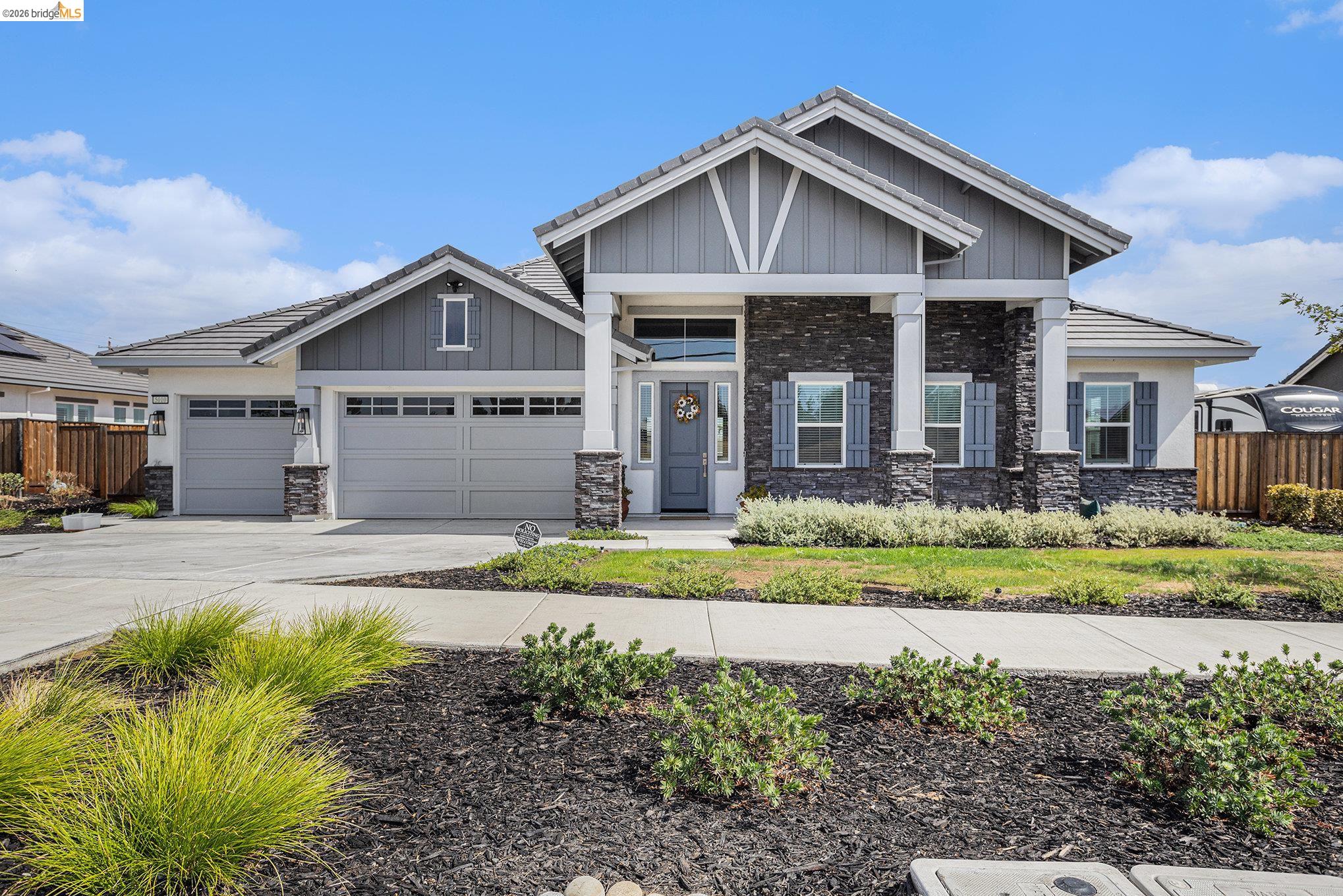 5010 Neroly Road Oakley, CA 94561 - Photo 2 of 40 a front view of a house with a yard and garage