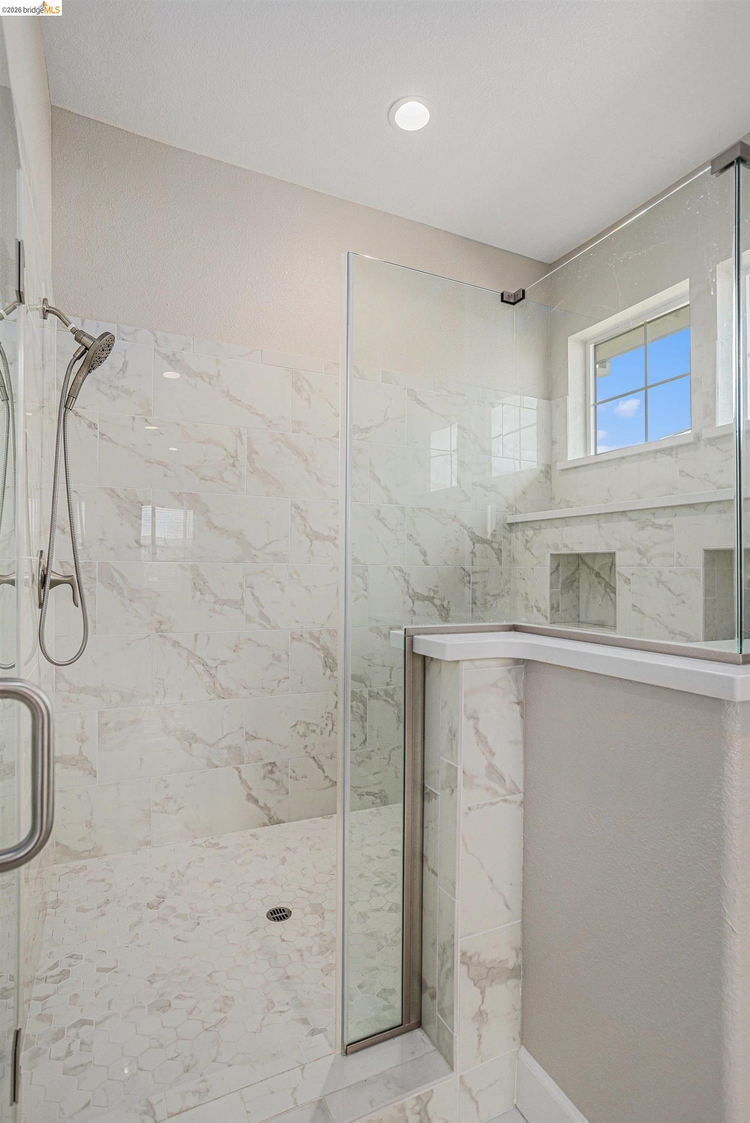 5010 Neroly Road Oakley, CA 94561 - Photo 23 of 40 a bathroom with a granite countertop shower a sink and a mirror