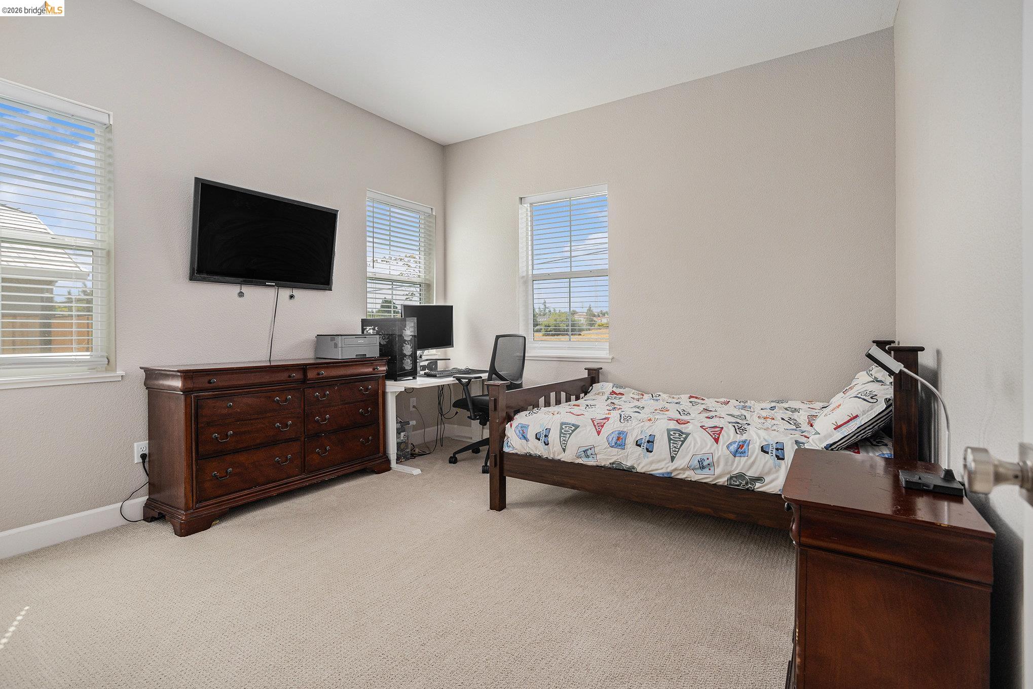 5010 Neroly Road Oakley, CA 94561 - Photo 25 of 40 a bedroom with a bed and a flat screen tv