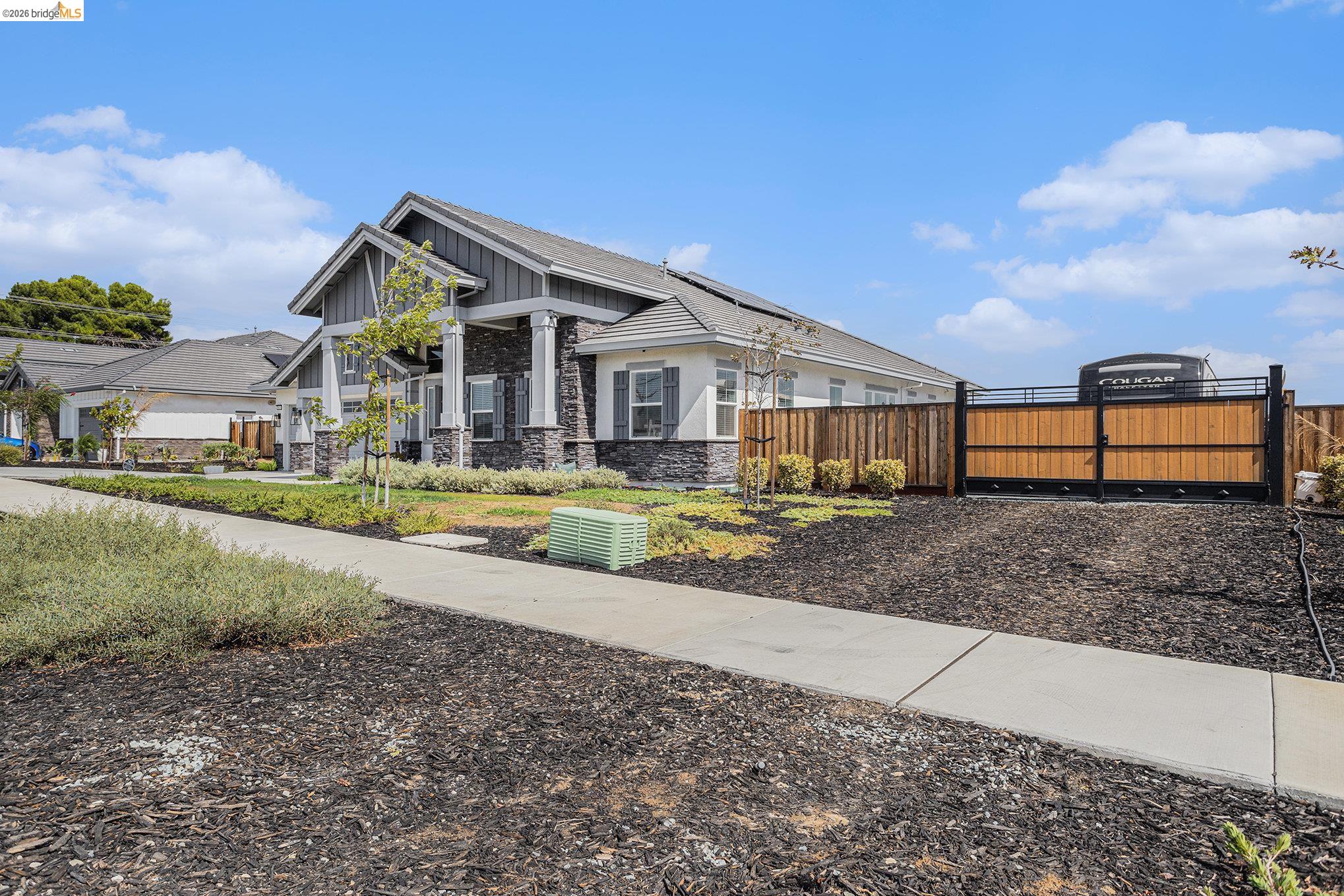 5010 Neroly Road Oakley, CA 94561 - Photo 6 of 40 a view of a house with a big yard and large trees