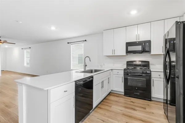 a view of kitchen with wooden floor