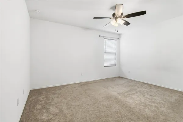 a kitchen with a sink and a refrigerator