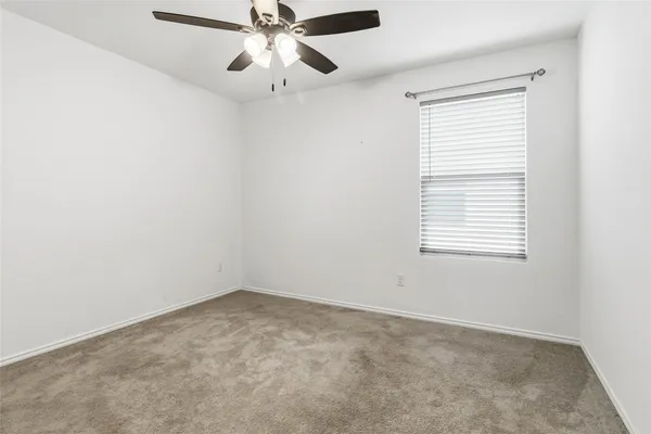 a view of storage and utility room with closet