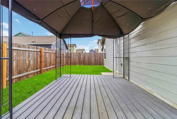 a view of a backyard with wooden floor