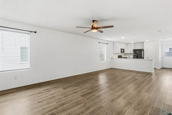 a kitchen with a sink stainless steel appliances and cabinets