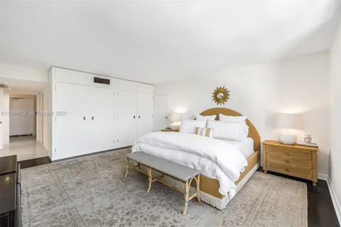 a bedroom with a bed and a table