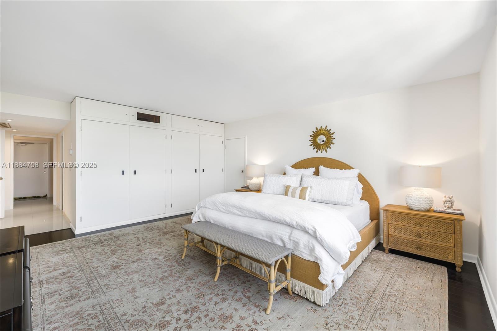 5660 Collins Avenue, Unit 8D Miami Beach, FL 33140 - Photo 19 of 41 a bedroom with a bed and a table