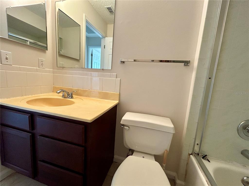 1907 Northwest 50th Circle Ocala, FL 34482 - Photo 12 of 25 a bathroom with a sink a toilet and a mirror