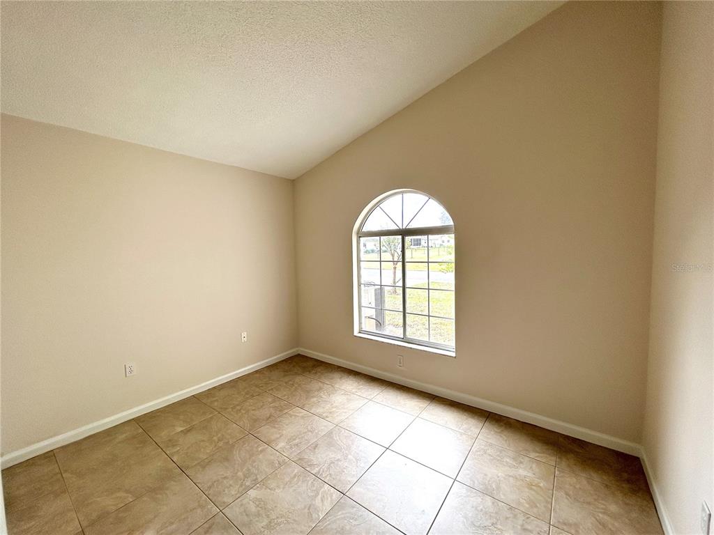 1907 Northwest 50th Circle Ocala, FL 34482 - Photo 13 of 25 an empty room with windows
