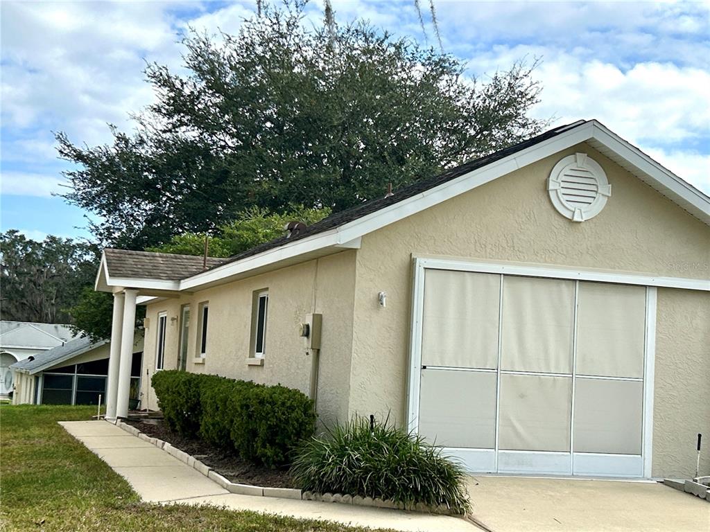 1907 Northwest 50th Circle Ocala, FL 34482 - Photo 2 of 25 a view of a house with a backyard