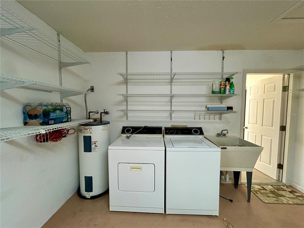 1907 Northwest 50th Circle Ocala, FL 34482 - Photo 22 of 25 a utility room with dryer and washer