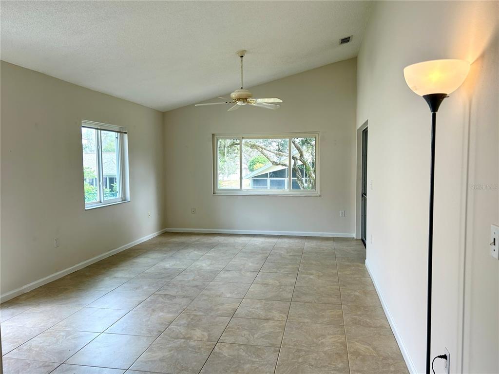 1907 Northwest 50th Circle Ocala, FL 34482 - Photo 5 of 25 a view of an empty room with a window