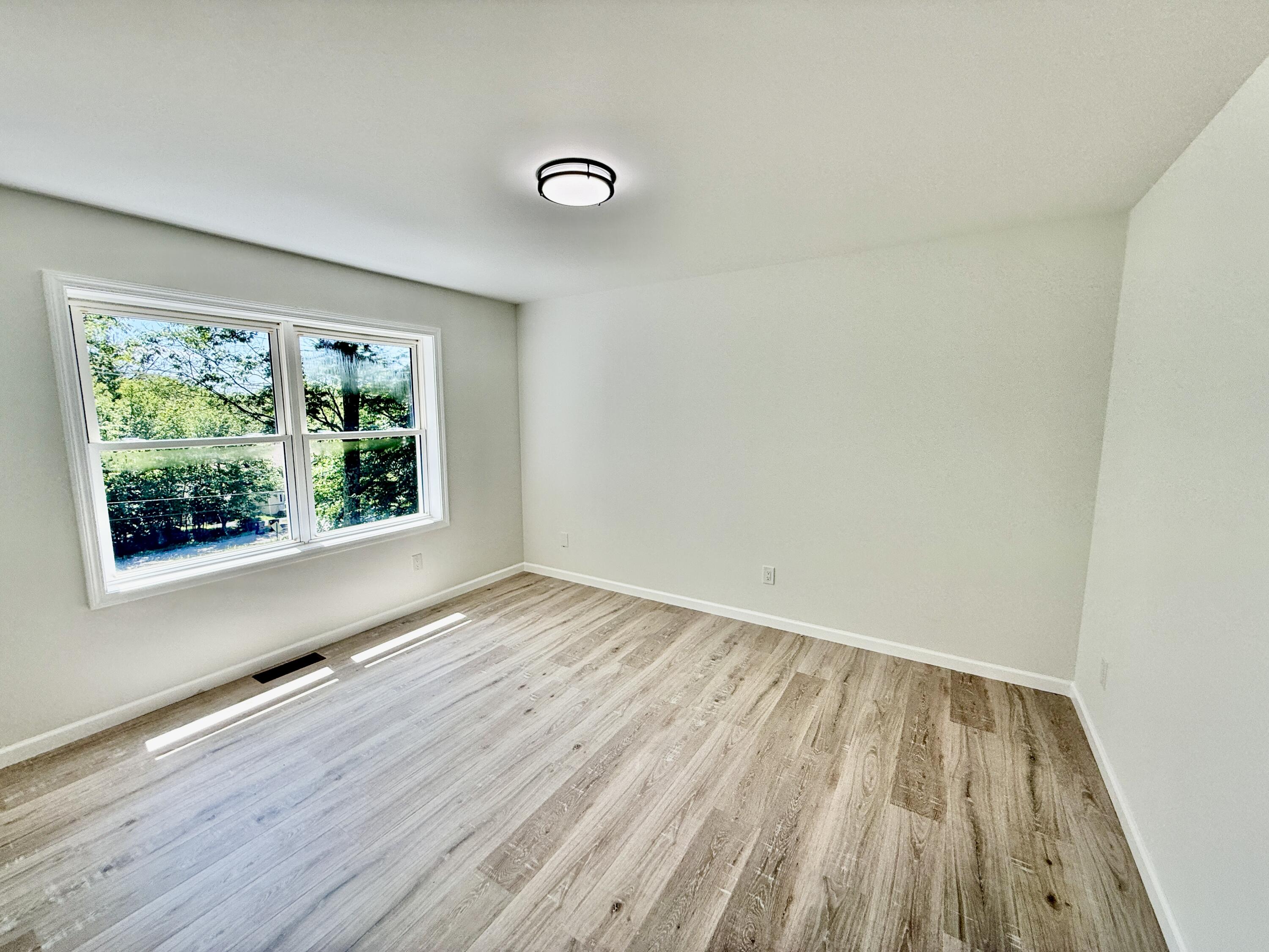459 Pocono Boulevard Bushkill, PA 18324 - Photo 15 of 62 a view of room with window and wooden floor
