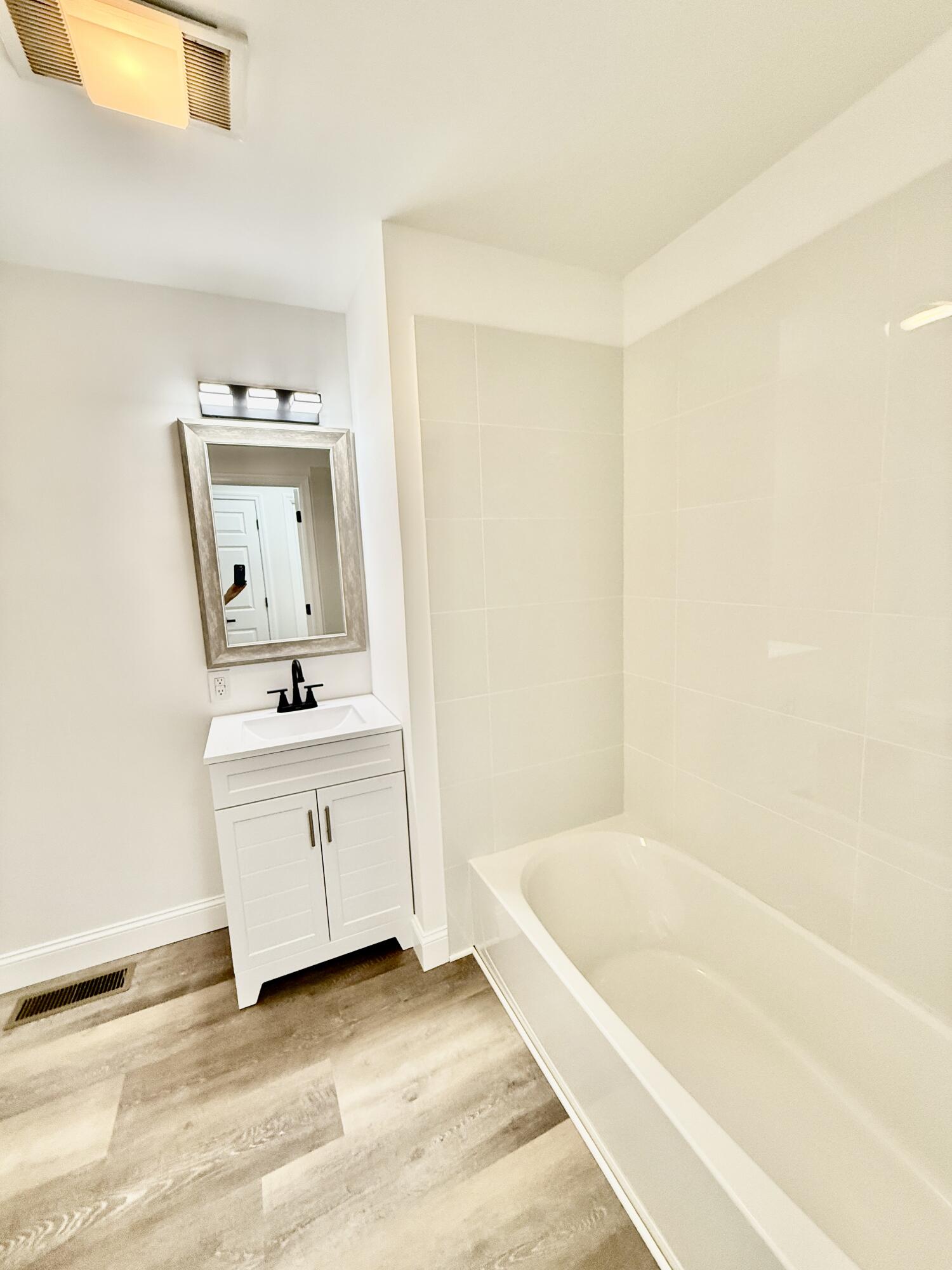 459 Pocono Boulevard Bushkill, PA 18324 - Photo 21 of 62 a bathroom with a bathtub sink and mirror