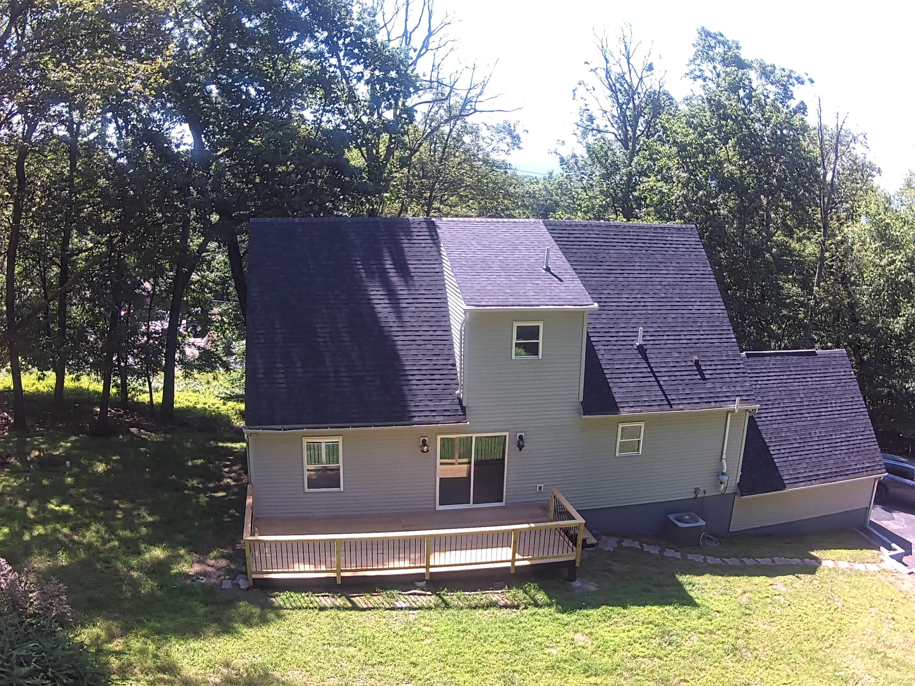 459 Pocono Boulevard Bushkill, PA 18324 - Photo 55 of 62 a aerial view of a house with swimming pool next to a yard