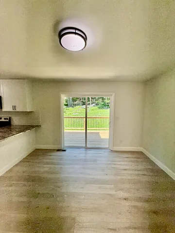 a view of a livingroom with wooden floor