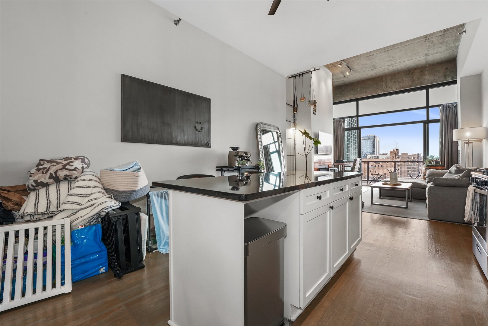 321 South Sangamon Street, Unit 902 Chicago, IL 60607 - Photo 10 of 18 a kitchen with stainless steel appliances granite countertop a sink dishwasher a stove and a refrigerator with wooden floor