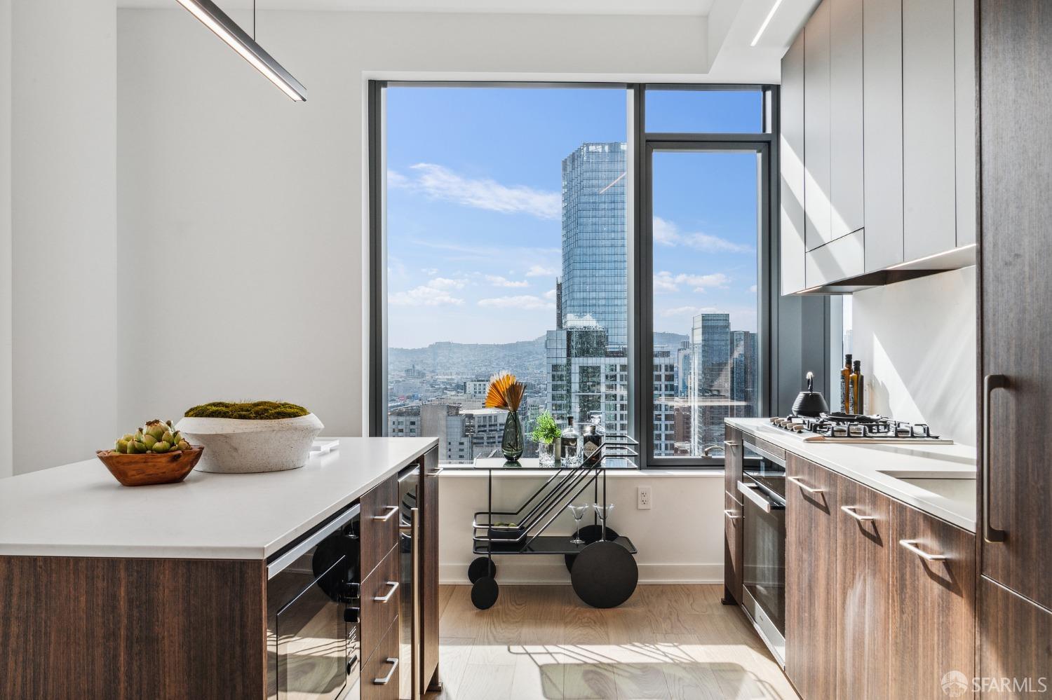 280 Spear Street, Unit 34C San Francisco, CA 94105 - Photo 12 of 47 a kitchen with a sink a stove and a refrigerator
