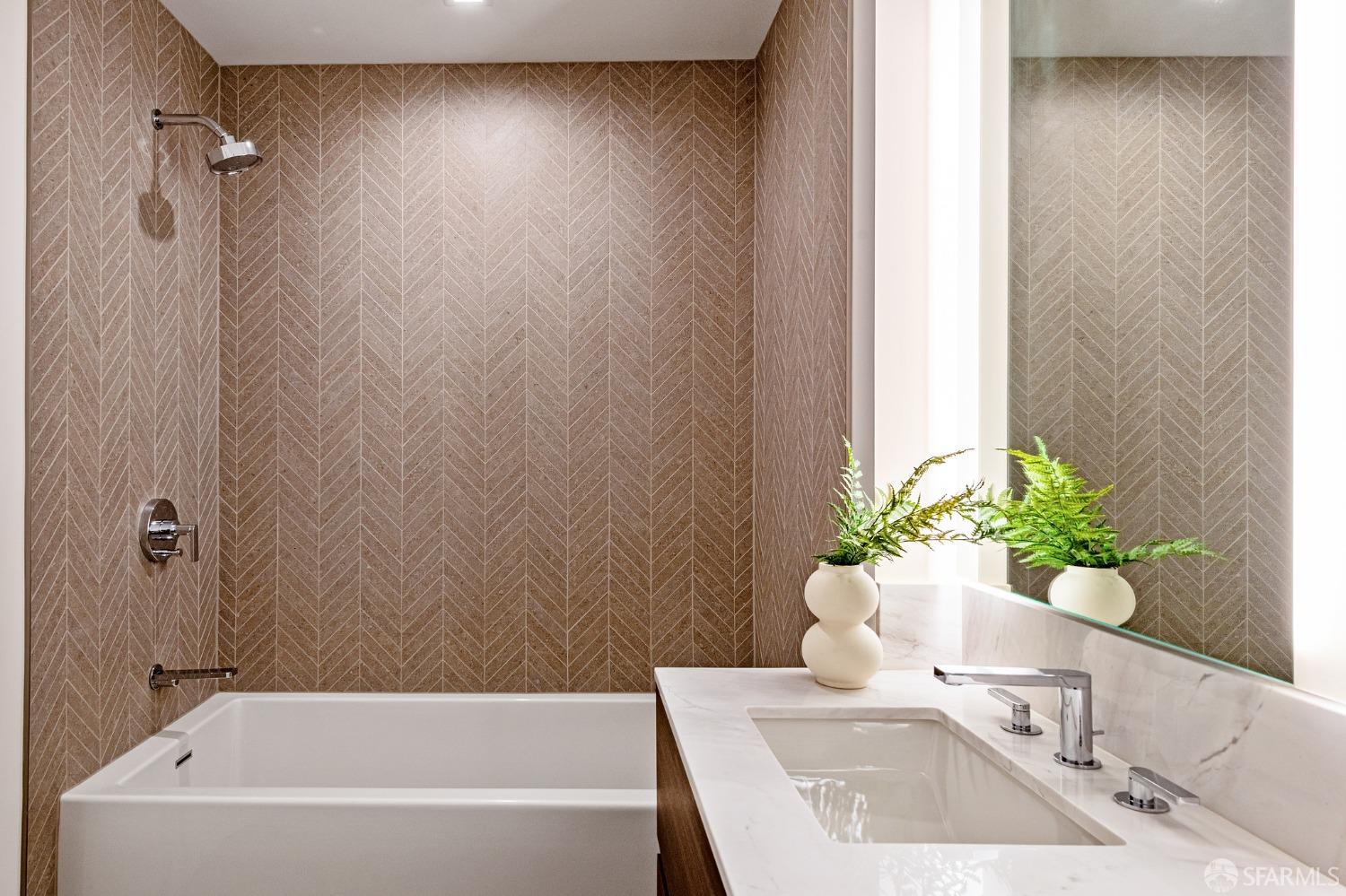 280 Spear Street, Unit 34C San Francisco, CA 94105 - Photo 20 of 47 a bathroom with a sink a bathtub and a shower