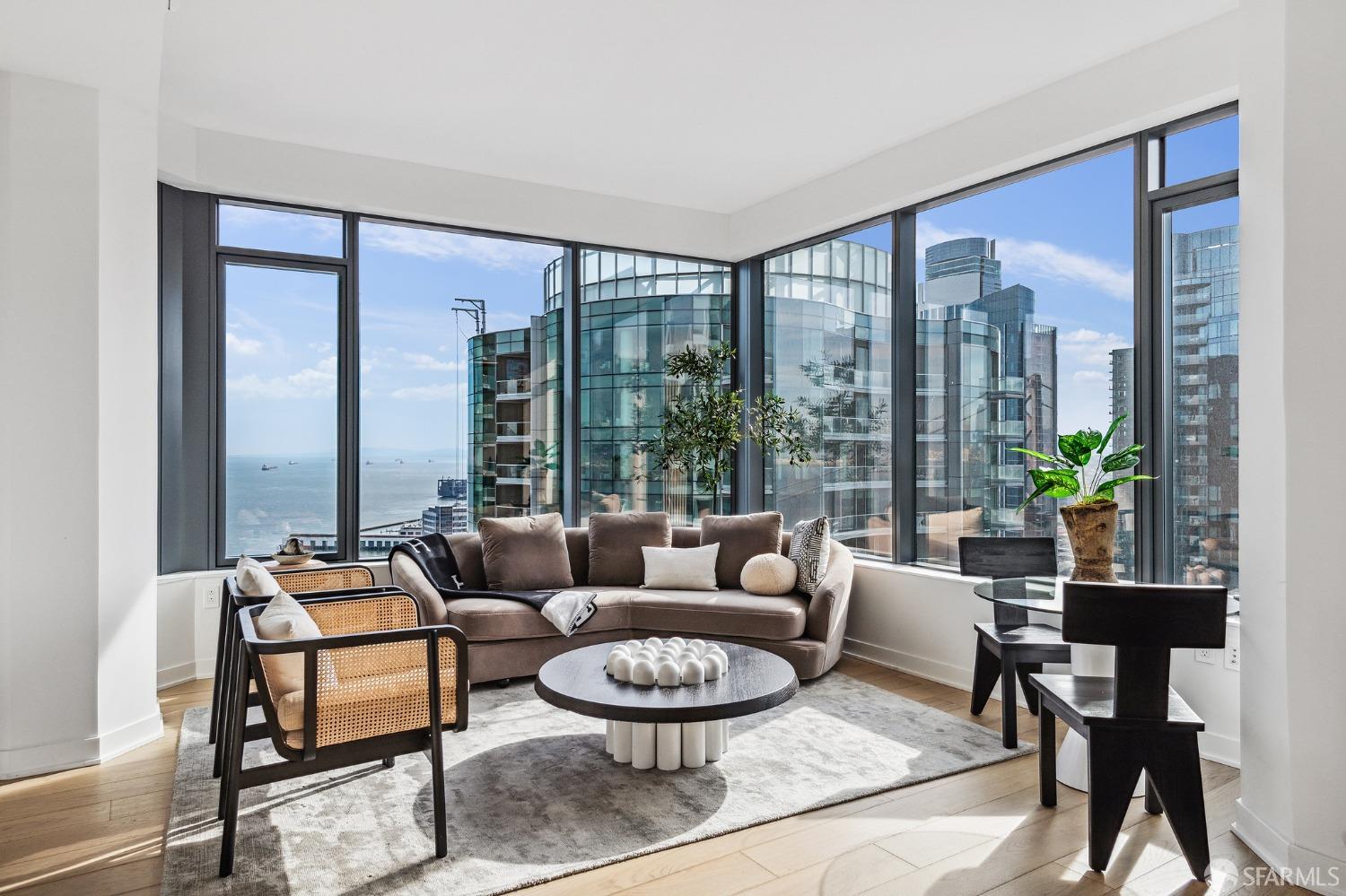 280 Spear Street, Unit 34C San Francisco, CA 94105 - Photo 3 of 47 a living room with furniture and a large window