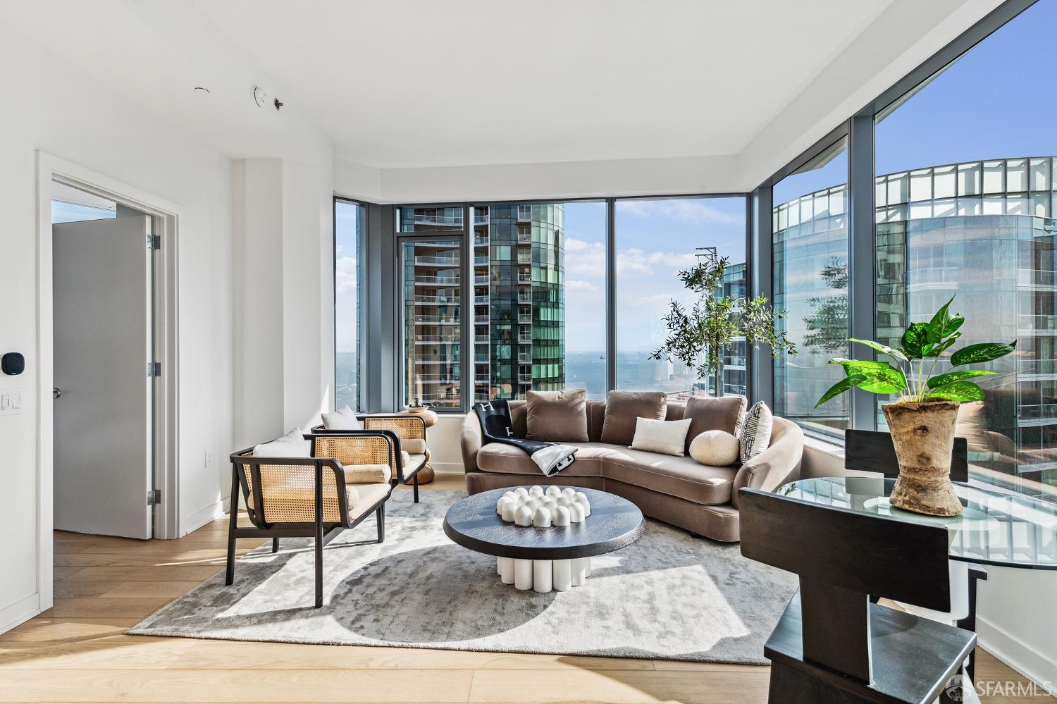 280 Spear Street, Unit 34C San Francisco, CA 94105 - Photo 4 of 47 a living room with furniture and a large window