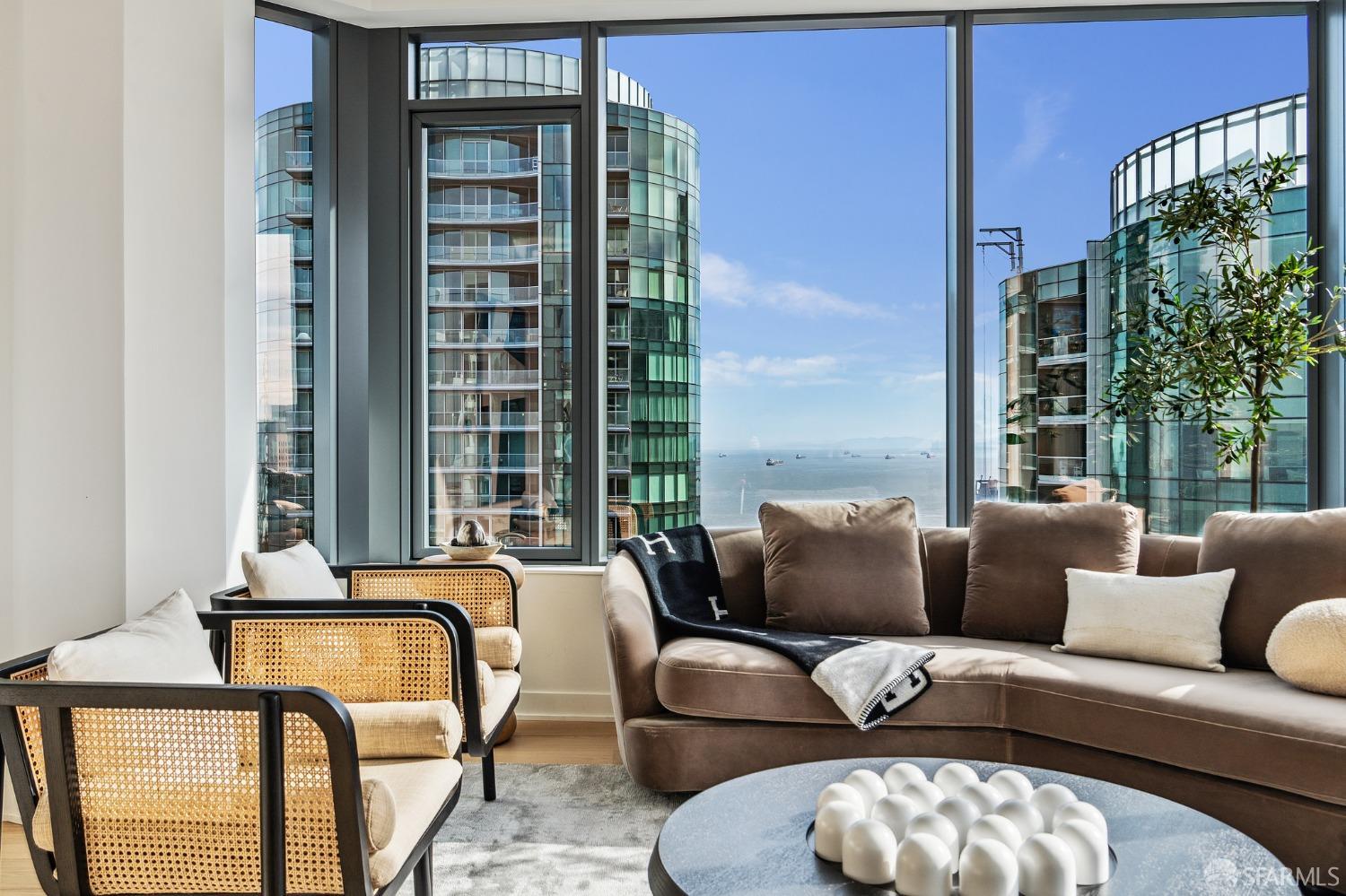 280 Spear Street, Unit 34C San Francisco, CA 94105 - Photo 6 of 47 a living room with furniture and a large window